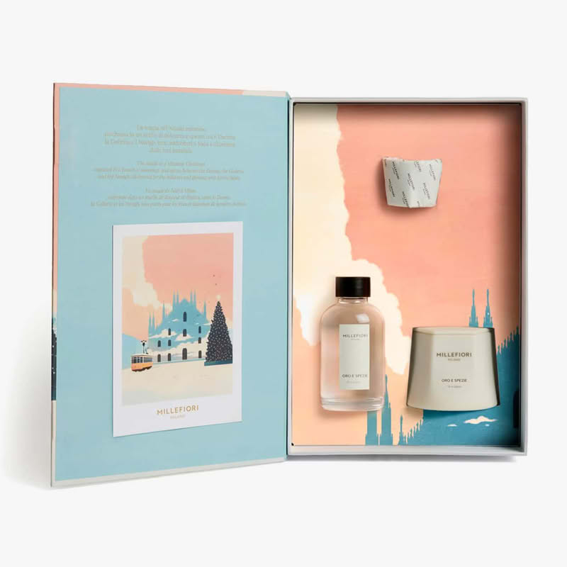 Cofanetto Millefiori in confezione con grafica a tema Natale milanese contenente una candela e un diffusore 100 ml di fragranza Oro e Spezie, per un bellissimo ed elegante regalo di Natale